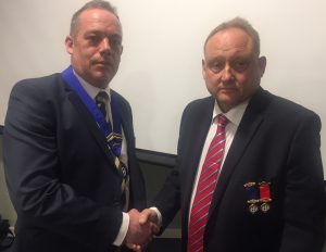 Ray Barnes (right) congratulates his successor as Chairman, Michael Tiney